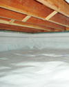 a moisture barrier installed on the walls and floors of a crawl space in Campaign